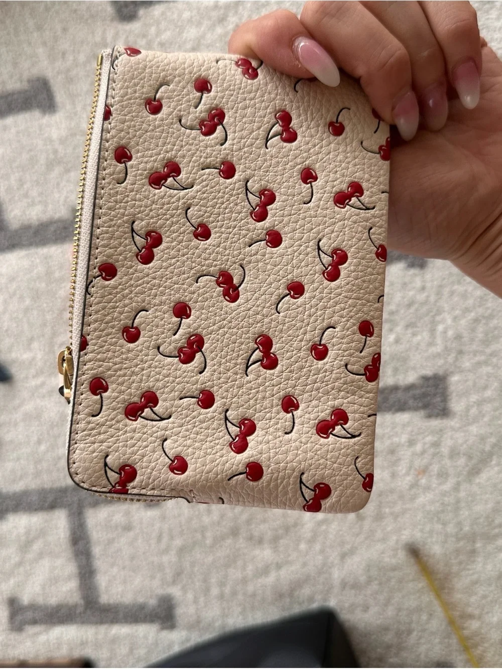 COACH Cream Leather Wristlet with Red Cherry Print